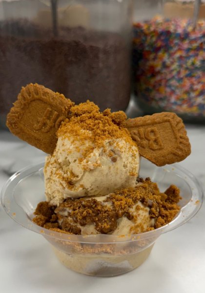 The Pumpkin Biscoff Sundae: two scoops in a clear cup, topped with Biscoff cookies and a crunchy cookie crumble
